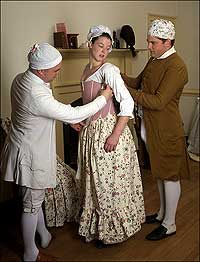 Tailor
Mark Hutter, left, and apprentice Neal Hurst, right, measure interpreter
Christina Diffel for stays