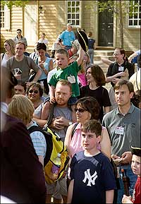 One of the younger patriots raises his hat to the cause.