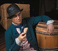 Justin Clement prepares to eat hardtack.