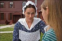 Interpreters Carolyn Wilson and Rebekah Horsting square off before a delousing.