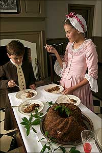 Martin and Rachel Harcourt indulge in slices of Twelfth Night cake.