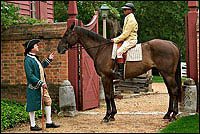 The sport of kings skewed less royal in the colonies, though still well-heeled
and -shod owner, jockey, and horse. At public gatherings such as court and
muster days, races were featured events. Phil Shultz, left, and Emmanuel Dabney
play the ponies.