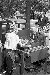 1961 photo of man with traveling forge