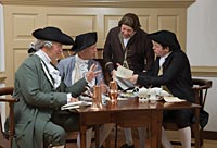 From left, interpreters Mark Sowell, Frank Megargee, Phil Shultz, and Jeffrey Villines, refreshed with coffee and tea, talk over news of the day at Charlton's.