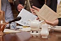 papers and coffee on table