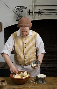 Brantley packs the ice cream into the top and bottom halves of a mold.