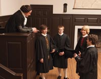 Before becoming president of the College of William and Mary, Stith served seven years as master of its Wren Building grammar school. Here he and students—from left, Fielding Kiser, Alan Burkett, Christopher Hochella, and Colin McKenzie—chat after class.