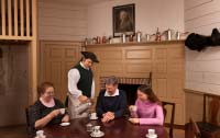 At Charlton’s Coffee House, Alan Ramsey pours cups of hot chocolate for, from left, Silvina Dasilva, James Ebert, and Lauren Ramsey.